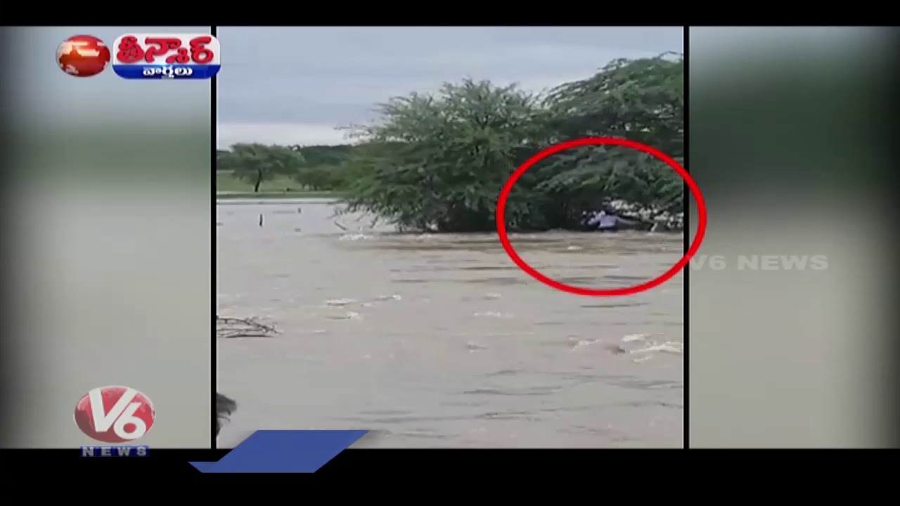 Car Washed Away In Flood Water | V6 Teenmaar News - YouTube