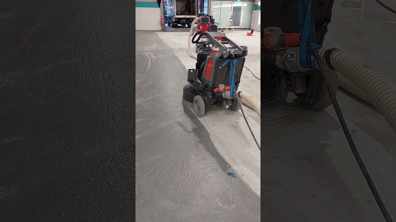 Husquvarna 830 remote controlled concrete grinder, preparing a factory floor for a new coating.