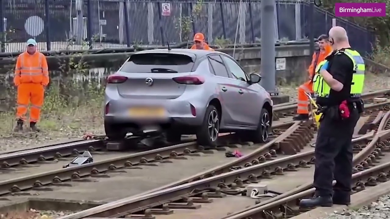 Workers Remove Stuck Car From Tram Tracks At Snow Hill