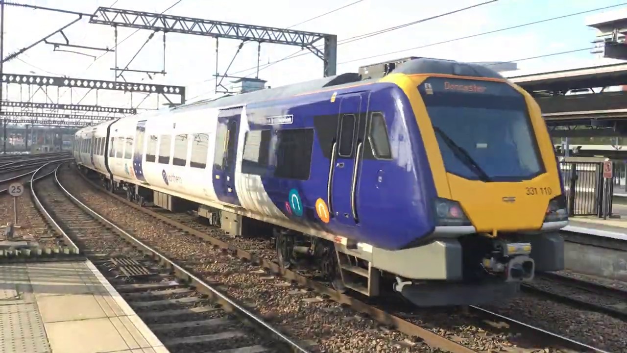 Northern Rail 331 110 departs Leeds Railway Station with the 12:21 ...