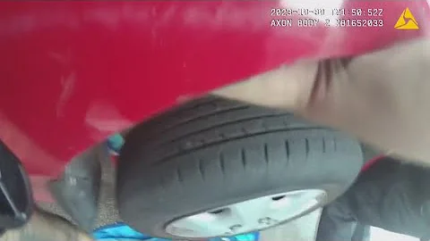 Police officers in Florida lift car off trapped man