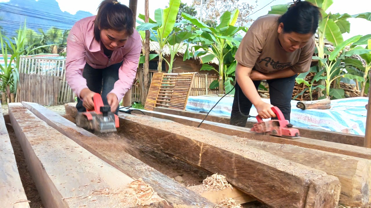 The beginning of the new house: HA went to great lengths to help DAN plane the large wooden pillars.