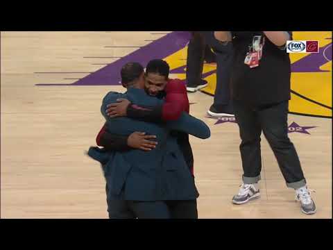 Tristan Thompson and LeBron James hug at halftime of Cavs-Lakers