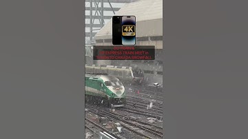 GO Train & UP Express Train Cross Paths during First Snowfall in Toronto Canada. iPhone 14 Pro Max.
