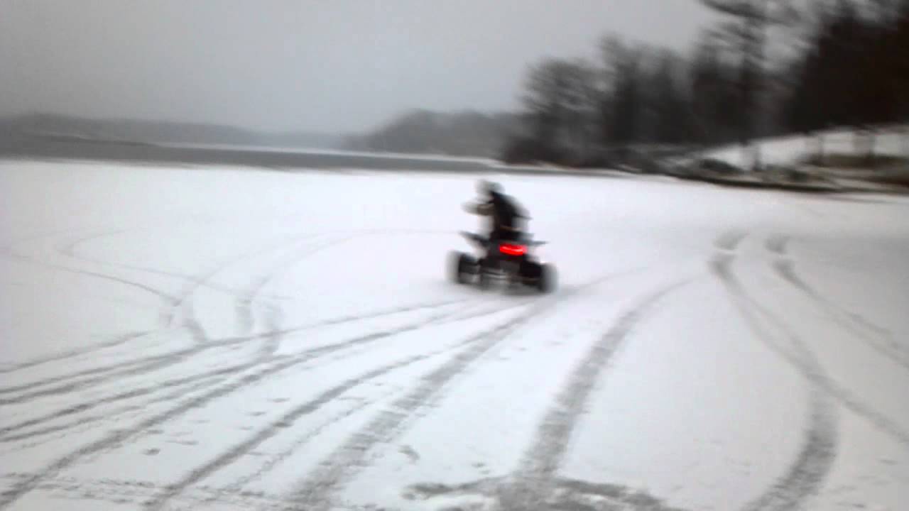 Kid rides 4 wheeler on frozen lake YouTube