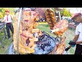 Argentine Masters Roast Two Huge Pyramids of Meat. Street Food Event in Italy