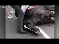 Carriage driver kicks exhausted horse in the head after it collapses on busy road
