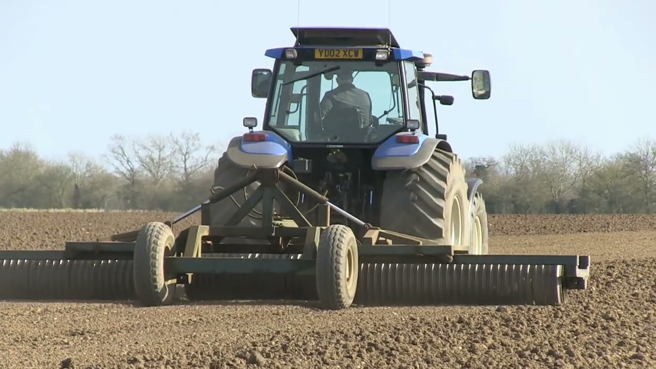 NEW HOLLAND TS115 AND ROLLS