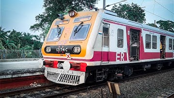 The icf medha emu local train enters the station and proceeds to its destination .