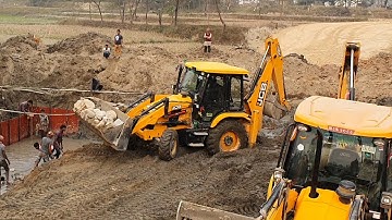 JCB Backhoe Machine Carrying Stone - JCB Working For Bridge Foundation Construction