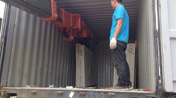 Crane unloading marble slab
