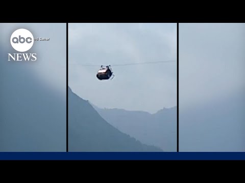 Rescue underway for children dangling from cable car in Pakistan | ABCNL