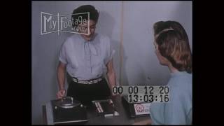 1950s Woman Grocery Shops at IGA Using Electronic Key Items