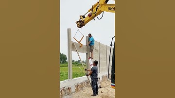 cool technique for installing a concrete wall fence with the help of an excavator #shorts