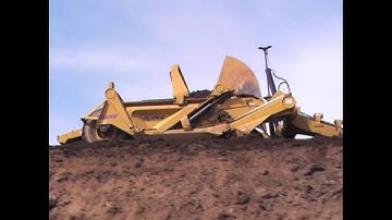 K-Tec 1233 Unloading Top Soil.wmv