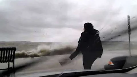 Girl test's hurricane Sandy's furious forces!