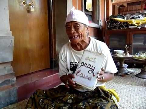 Ketut Liyer - Part 1 showing us Eat Pray Love book...