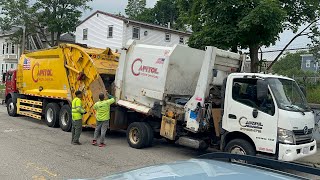 Mini Garbage Truck Dumping Into a McNeilus Rear Loader