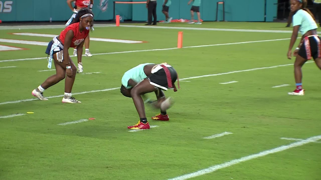 Spanish River flag football team plays at halftime of Dolphins game