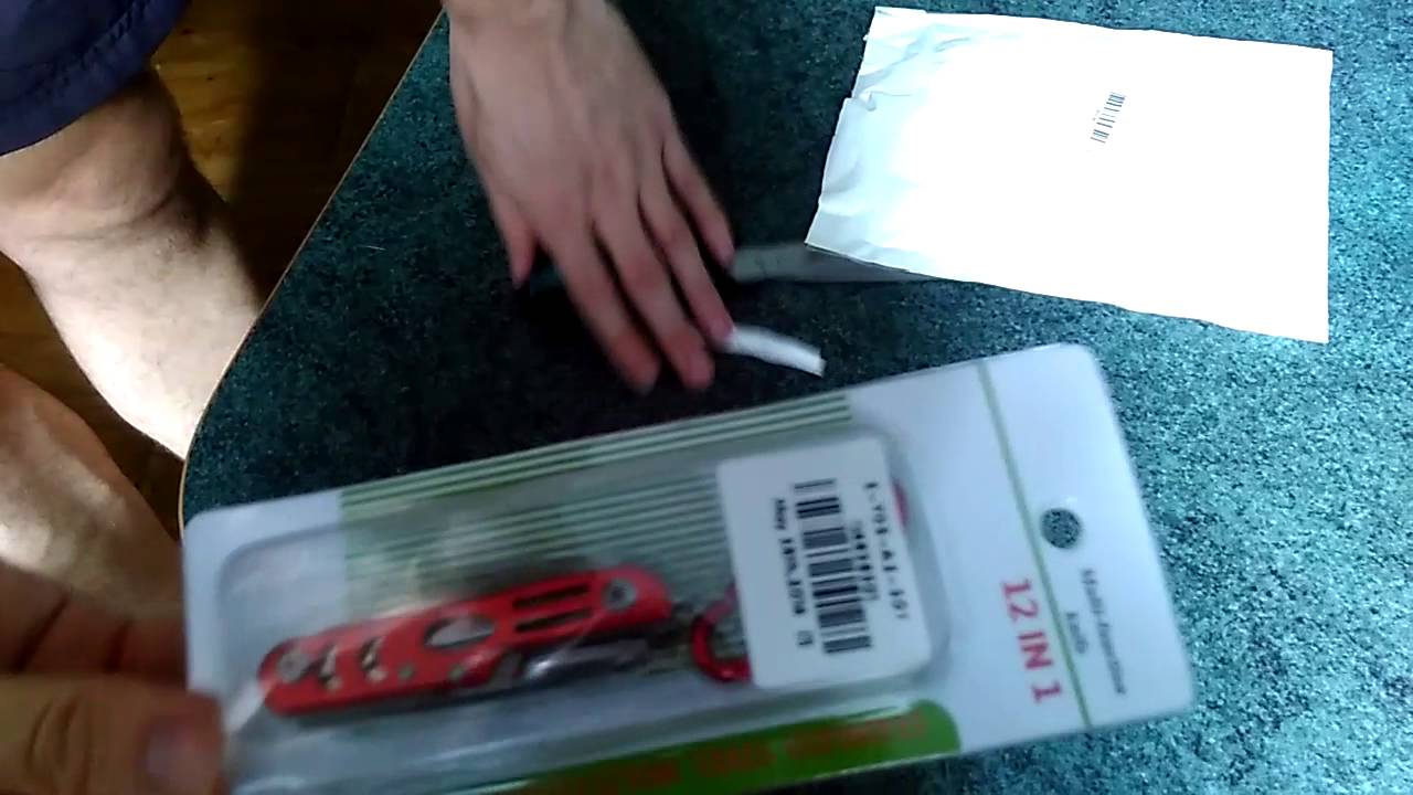 Multi-tool: Practical 12 in 1 Knife Scissor Bottle Opener Corkscrew..