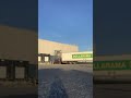 Docking tractor trailer next steel bin front view