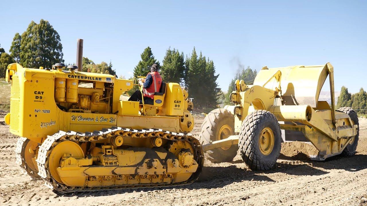 Vintage Caterpillar D9 Series D operating with a Towed Scraper in