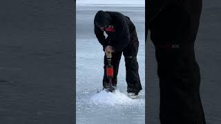 Drilling a hole for ice fishing! 🎣 #icefishing #alaska #alaskaextreme #winter #ice #shortsfeed