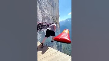 Cliff trampoline launches tourist?! 😱💥 That jump was insane! #SkyBounce #ExtremeJump