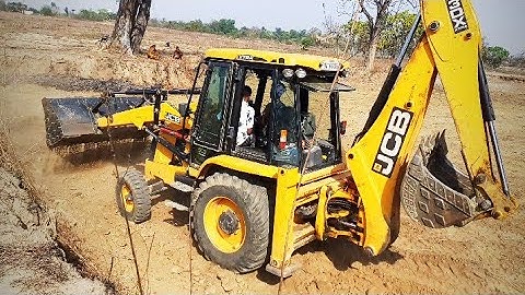 JCB Backhoe Shifting Soil And Mixing Soil For Making Bricks