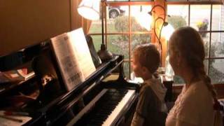 Jacob, 5, a piano duet with his teacher,