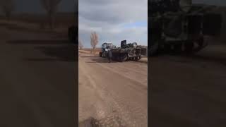 Russian Tank being towed by Tractor