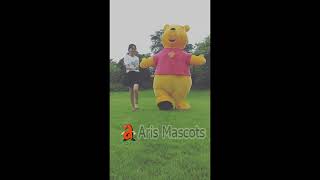 Adult Giant Inflatable Winnie the Pooh Bear Costume Jumping in the Park