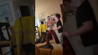 Woman plays VR Virtual Reality fighting game on Oculus then accidentally punches little boy on face