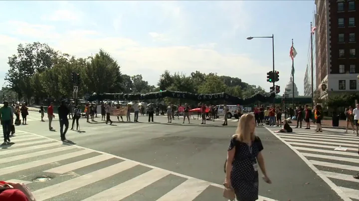 Climate change protesters block traffic at major intersections through out D.C.