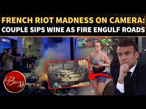 France Riot MADNESS: Couple Enjoy Drinks Beside FLAMES As Woman Jogs Past Burning E-Bikes
