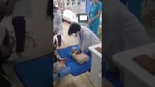 Doctor slap dummy while doing CPR
