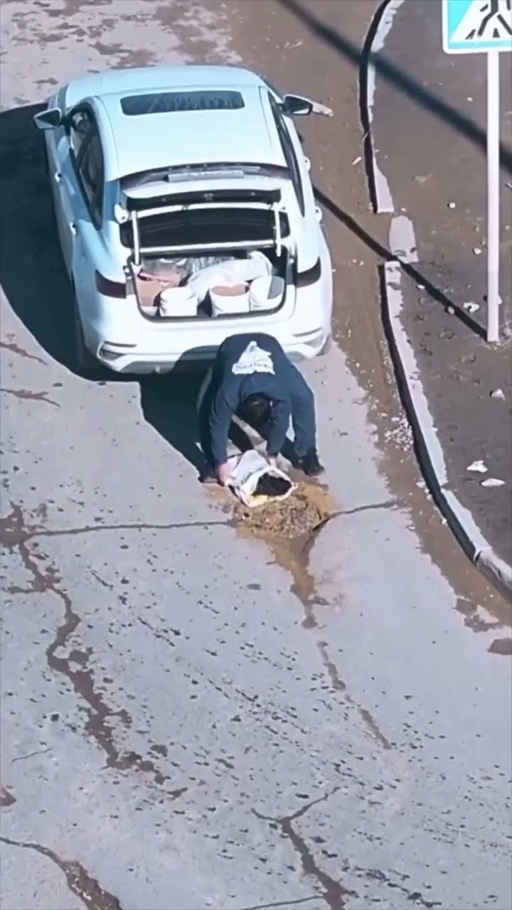 Man Fixes Pothole In Road || ViralHog