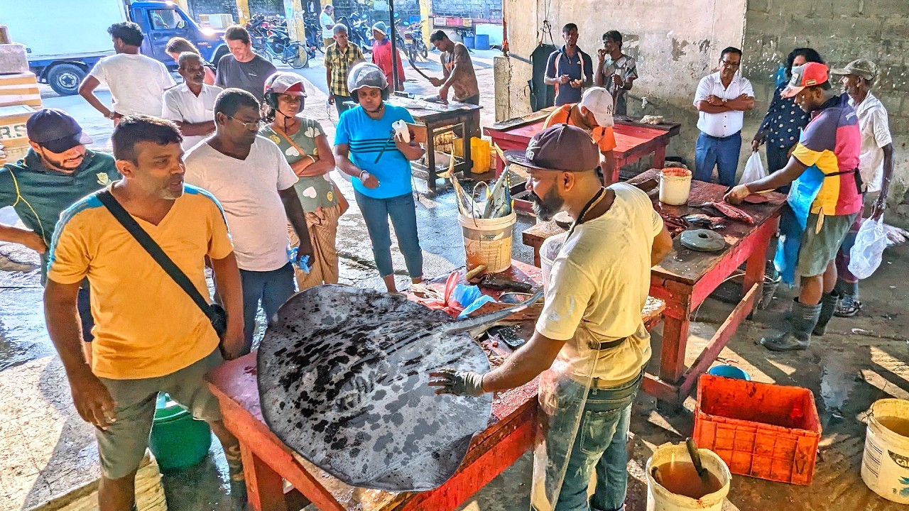 Street Market Showcasing Skillful Shark Cutting Techniques