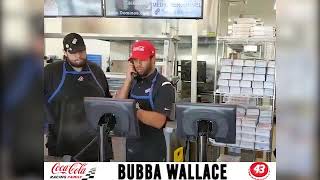 Coca-Cola Family Racing Partner #43 Bubba Wallace takes a call at Dominos
