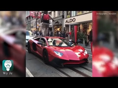 Moment man runs on top of parked red Lamborghini