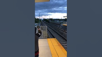 Acela train passing Mansfield 150 mph at evening time.
