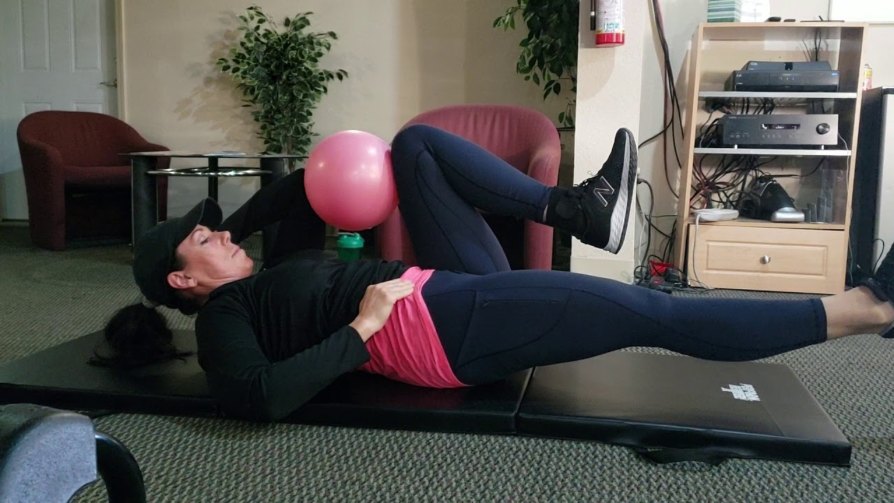 Single leg leg raise with ball squeeze hold - YouTube
