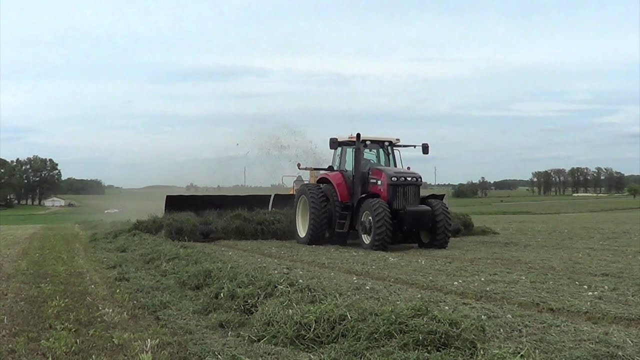 First Cutting Hay 2015 in Wisconsin Merging Windrows of Hay - YouTube