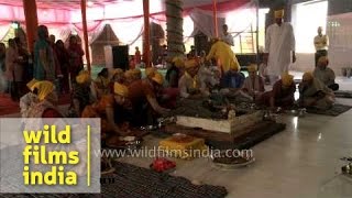 Priests reciting mantras for 'Prana pratishta' ceremony at Saisthanam temple, Dehradun