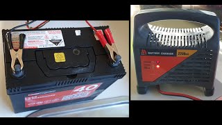 Charging flat car battery with a manual battery charger