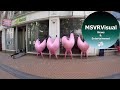 Pink Inflatable Men Entertain Bewildered Shoppers In Birmingham