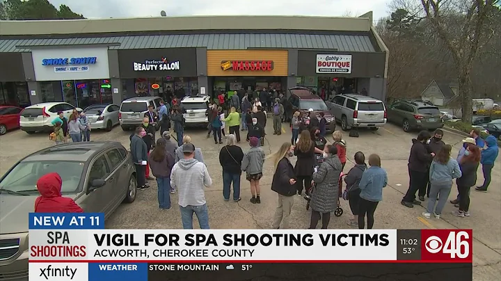 Dozens gather at vigil after massage parlor shootings