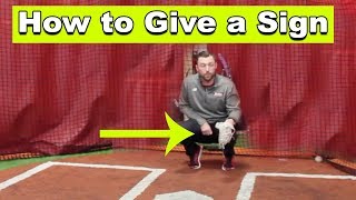 How the catcher gives signs to the pitcher