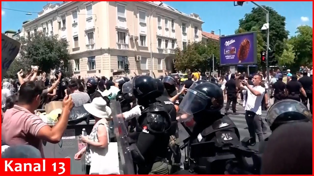 Demonstrators react as Serbian police remove protest blockades in capital Belgrade