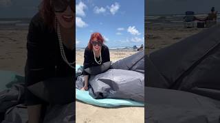 Putting up a beach tent is hell